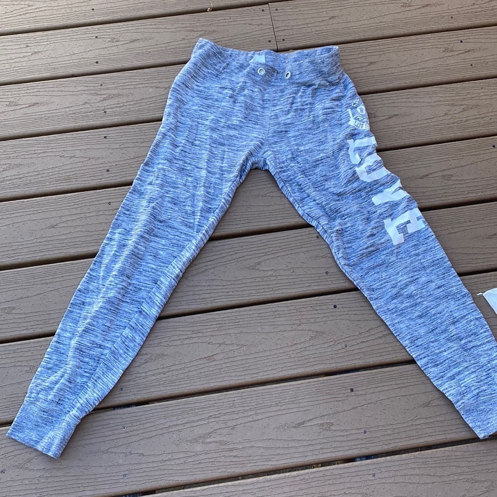 I am selling gray sweatpants that say love in white on the side.